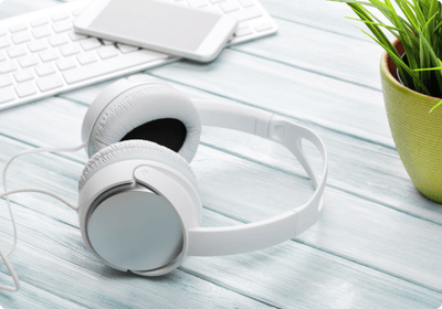 White headphones on a desk