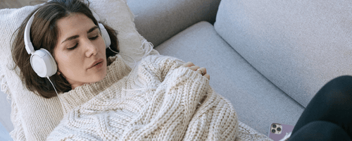 Woman relaxing with white headphones